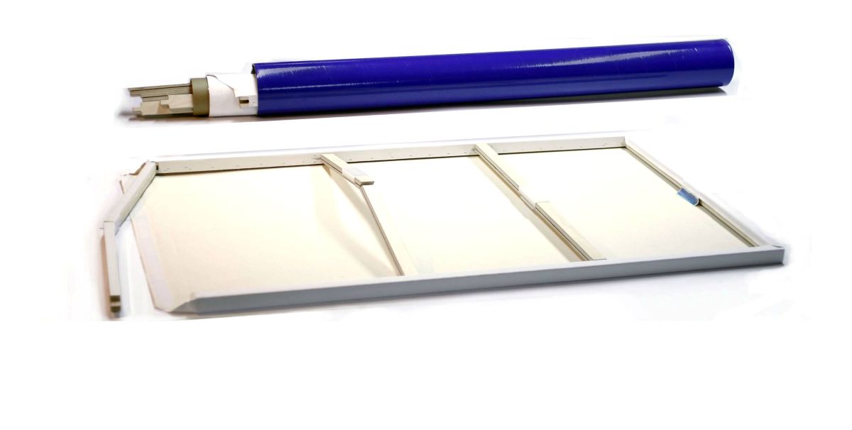 Disassembled parts of a white canvas frame and the canvas material itself.